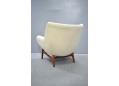 Very stylish vintage armchair on teak legs made by Henry Rolschau