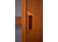 Solid teak carved handle on the sliding doors is a signature design detail.