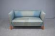 Blue fabric compact frame sofa with coil sprung seating for sale. 