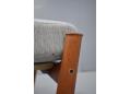 Teak framed Danish footstool with sprung cushion in grey fabric upholstery.