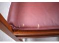 Brown leather seat cushion can be flipped for an even wear.
