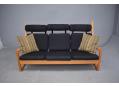 Midcentury Danish design high back sofa with light oak frame.