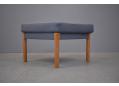 Fritz Hansen produced foot stool with oak legs & new blue colour fabric upholstery.