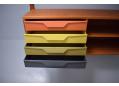 Stylish coloured metal drawers are very rare and make the system unique.