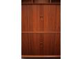 Sliding tambour doors in solid teak with carved handles.