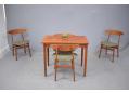 A stylish small dining set with folding table top and Vilhelm Wohlert chairs