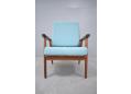 Vintage teak frame armchair with loose fully upholstered cushions.