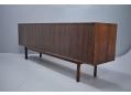 The back is also in rosewood, allowing the sideboard to be used in the middle of a room.