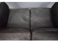 2 seat sofa made in Denmark with worn leather upholstery
