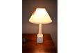 Midcentury table lamp in white ceramic and with pleated shade.