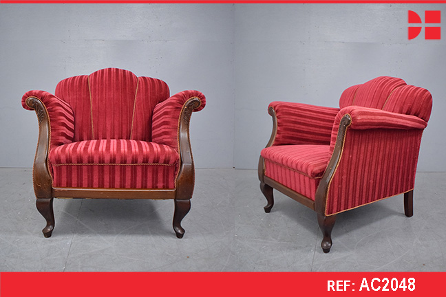 Large antique armchair with dark wood carved detail and red veloiur upholstery