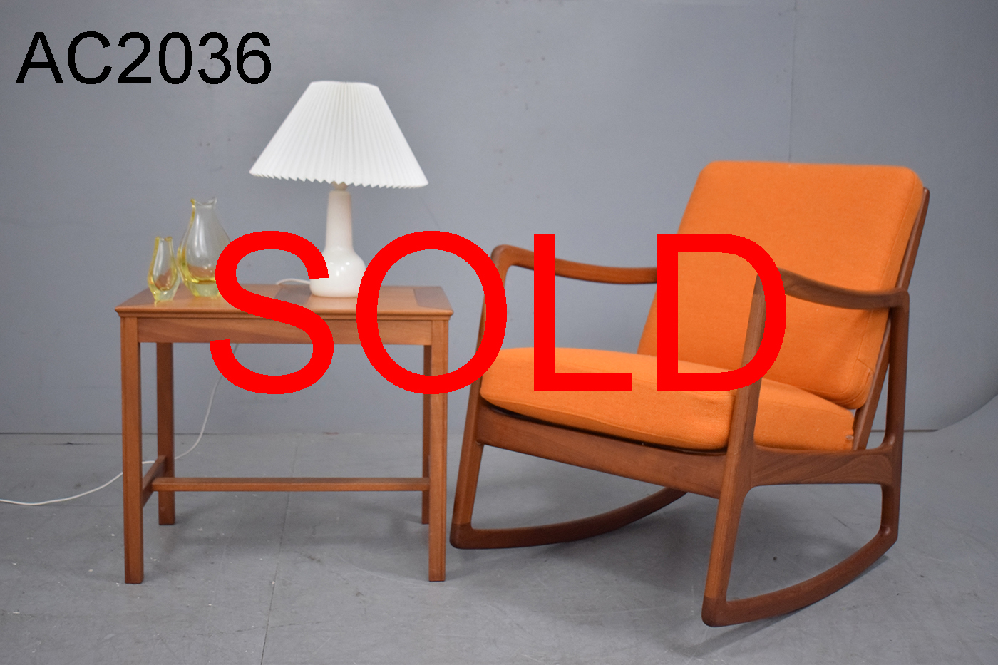 Midcentury teak rocking chair designed by Ole Wanscher model FD120