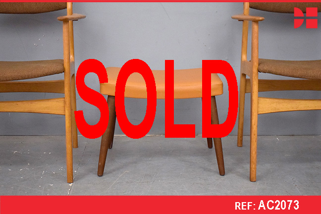 Small occasional footstool with tan vinyl upholstery