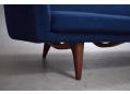 The sofa stands on teak leg frames which are a lovely contrast to the blue upholstery.