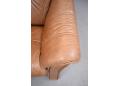 Comfortable modern design 2 seat sofa with small frame in brown leather.