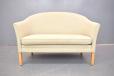 Modern Danish design 2 seater sofa with cream upholstery