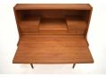 Pull-out writing desk is quick and smooth to operate. 