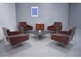 Arne Jacobsen chairs go perfectly with POUL KJAERHOLM's slate table 