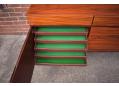 Shallow cutlery drawers lined with green felt. A standard Danish lining 