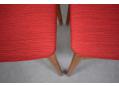 Original red fabric upholstered seats on Omann Junior 1954 stools.