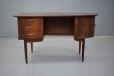 Stylish writing desk featuring asymmetric top with a compact design