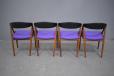 Model 31 dining chairs in teak with black back and purple seat