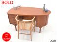 Curved teak desk with cupboard