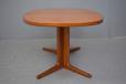 SMall teak dining table with oval top produced 1960s