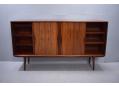 Features large internal storage with adjustable shelves.