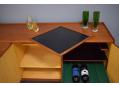 The drinks cabinet even comes with a reversible black / red serving tray.