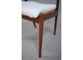 The elegant legs at the rear narrow inward to give the chair a slimmer appearance. Model 42