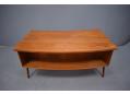 Stylish vintage desk in teak with open large width storage on the back.