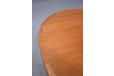 Teak dining table made in Denmark with oval top & 2 leaves.