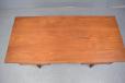 Teak desk top with signs of use and repaied veneer on leading edge