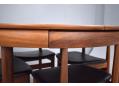 The chairs sit flush underneath the table top when not in use.