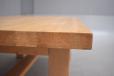 Visible end grain on each stave shows the table's solid construction