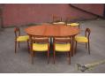 1960s Danish dining table with circular top and 4 extra leaves to seat 10 -12