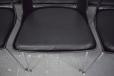 The moulded glass fibre and plastic chair seat is black and in great condition
