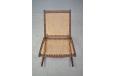 Vintage 1960s teak frame rocking chair with woven cord back and seat rest