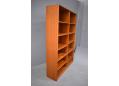 Danish made teak bookcases with adjustable shelving on hidden supports.