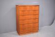 The chest of drawers is supported on a plinth base.
