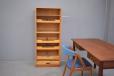 Tall office cabinet in light oak with drawers and drop down tambour door.