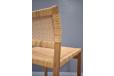 Woven cane side chairs with oak frames made in Denmark.