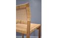 Woven cane side chairs with oak frames made in Denmark.