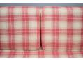 Foam cushions upholstered in pale red and cream check upholstery in good condition.
