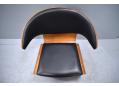Black leather upholstered easy chair with teak frame, model BIKINI.