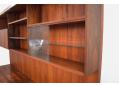The top section is ideal for display use and features a glass sliding door cabinet.