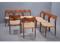 8 model 71 teak framed dining chairs with woven papercord  seats by Niels Moller.