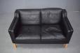 EVA 2 seater sofa in black ox leather which has lovely grain patterns