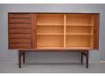 Sliding tambour door sideboard with internal, adjustable shelves.